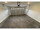 Spacious two-car garage with concrete floor and automatic door at 106 Gilliatt St, Shelby, NC 28150