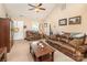 Living room with leather sofas, a coffee table, and access to other rooms at 1195 Allison Bluff Trl, Rock Hill, SC 29732