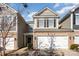 Attractive two-story townhome with a two-car garage and landscaping at 1206 Croft Dr # 98, Fort Mill, SC 29708
