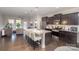 Modern kitchen with granite counters, dark cabinets, and island at 1206 Croft Dr # 98, Fort Mill, SC 29708