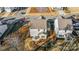 Aerial view of a well-maintained home featuring a patio, firepit, and fenced yard in a residential neighborhood at 128 Shay Crossing Rd, Salisbury, NC 28146