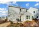 Small back patio with seating area and a view of the neighborhood at 128 Shay Crossing Rd, Salisbury, NC 28146