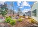 A backyard sitting area around a firepit provides a relaxing and enjoyable outdoor space at 128 Shay Crossing Rd, Salisbury, NC 28146