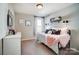 Cozy bedroom with charming decor, a comfortable bed, and natural light at 128 Shay Crossing Rd, Salisbury, NC 28146