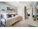 Comfortable bedroom with soft furnishings and a decorative wall shelf at 128 Shay Crossing Rd, Salisbury, NC 28146