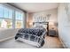 Inviting bedroom with large windows, side tables, and stylish bedding at 128 Shay Crossing Rd, Salisbury, NC 28146