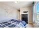 Bright bedroom with a map wall decoration, dark dresser, and neutral colors at 128 Shay Crossing Rd, Salisbury, NC 28146