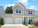 Charming home with a two-car garage and manicured landscaping offers appealing curb appeal at 128 Shay Crossing Rd, Salisbury, NC 28146