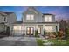 Two-story home with gray siding, double doors, and a black fence at 128 Shay Crossing Rd, Salisbury, NC 28146