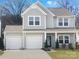 Charming two-story home with a two-car garage and well-maintained landscaping for curb appeal at 128 Shay Crossing Rd, Salisbury, NC 28146