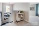 Upper hallway with a decorative shelf and neutral carpet at 128 Shay Crossing Rd, Salisbury, NC 28146
