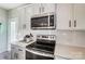 Well-equipped kitchen with stainless steel appliances and subway tile backsplash with quartz countertops at 128 Shay Crossing Rd, Salisbury, NC 28146