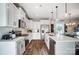 Modern kitchen features sleek stainless steel appliances, ample cabinetry, and quartz countertops at 128 Shay Crossing Rd, Salisbury, NC 28146