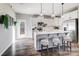 Bright kitchen with stainless steel appliances, kitchen island, and stylish pendant lighting at 128 Shay Crossing Rd, Salisbury, NC 28146