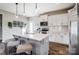Contemporary kitchen featuring a center island with seating, white cabinets, and stainless steel appliances at 128 Shay Crossing Rd, Salisbury, NC 28146