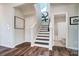 Modern staircase with dark wood treads and white risers at 128 Shay Crossing Rd, Salisbury, NC 28146