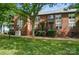 Brick townhomes with manicured landscaping and inviting entrances at 128 Steinbeck Way # E, Mooresville, NC 28117