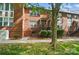Brick townhomes with manicured landscaping and inviting entrances at 128 Steinbeck Way # E, Mooresville, NC 28117