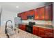 Well-equipped kitchen with granite counters, ample cabinet space, and stainless steel appliances at 128 Steinbeck Way # E, Mooresville, NC 28117