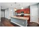 Spacious kitchen featuring stainless steel appliances, a large island, and cherry wood cabinets for ample storage at 128 Steinbeck Way # E, Mooresville, NC 28117