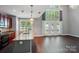 Bright kitchen with stainless steel appliances, granite countertops, and double-height ceilings with lots of light at 128 Steinbeck Way # E, Mooresville, NC 28117
