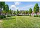 Exterior view of lawn and townhouse complex at 128 Steinbeck Way # E, Mooresville, NC 28117