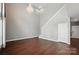 This living room features hardwood floors, tall ceilings, and ample space at 128 Steinbeck Way # E, Mooresville, NC 28117