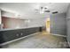 Loft area featuring neutral walls, carpet, and chandelier lighting at 128 Steinbeck Way # E, Mooresville, NC 28117
