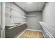 Walk-in closet with installed shelving and carpeted floors at 128 Steinbeck Way # E, Mooresville, NC 28117