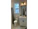 Clean bathroom with vanity, toilet, shower, and window at 14016 Felix Ln # 6, Charlotte, NC 28277