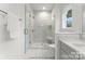 Bright, spacious shower with glass enclosure and built-in shelving at 1409 Downs Ave, Charlotte, NC 28205