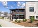 Exterior daytime shot of Summit Coffee with outdoor patio and modern architecture at 1409 Downs Ave, Charlotte, NC 28205