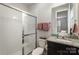 Bright bathroom with a glass-enclosed shower and granite-topped vanity at 15421 Keyes Meadow Way, Huntersville, NC 28078