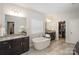 Bathroom with soaking tub and walk-in shower at 15421 Keyes Meadow Way, Huntersville, NC 28078