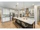 Modern kitchen featuring a large island, stainless steel appliances, and pendant lighting at 15421 Keyes Meadow Way, Huntersville, NC 28078