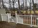 A deck and backyard featuring trees and greenery at 16721 Spinnaker Ln, Cornelius, NC 28031