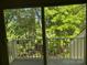 Balcony view overlooking lush green trees and foliage at 16721 Spinnaker Ln, Cornelius, NC 28031