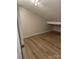 Cozy bedroom featuring wood floors and ample natural light at 16721 Spinnaker Ln, Cornelius, NC 28031