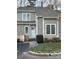 Charming townhouse featuring gray siding, white trim, and a welcoming front entrance at 16721 Spinnaker Ln, Cornelius, NC 28031