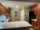 Modern kitchen with stainless steel appliances, a breakfast bar, and ample counter space at 16721 Spinnaker Ln, Cornelius, NC 28031