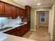 Updated kitchen featuring beautiful wood cabinets, quartz countertops, and stainless steel appliances at 16721 Spinnaker Ln, Cornelius, NC 28031