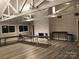 Large multipurpose room with a high ceiling, brick fireplace and wood flooring at 16721 Spinnaker Ln, Cornelius, NC 28031