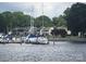View of boats docked on the water, surrounded by lush greenery and nearby homes at 16721 Spinnaker Ln, Cornelius, NC 28031