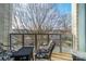 Relaxing balcony with seating overlooking mature trees and a picturesque view at 2116 Mcclintock Rd, Charlotte, NC 28205
