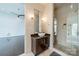 Modern bathroom features a vessel sink, granite countertop and large glass shower with tiled walls at 2116 Mcclintock Rd, Charlotte, NC 28205