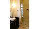 Modern bathroom boasts a stylish vessel sink, granite countertop and glass-enclosed tiled shower at 2116 Mcclintock Rd, Charlotte, NC 28205