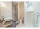 Well-lit bathroom featuring a glass enclosed shower, toilet, sink and a walk in closet at 2116 Mcclintock Rd, Charlotte, NC 28205