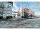 Exterior shot of building showing connecting walkway and residential street with parking at 2116 Mcclintock Rd, Charlotte, NC 28205