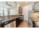 Galley kitchen with stainless steel appliances, granite countertops, and ample cabinet space is displayed at 2116 Mcclintock Rd, Charlotte, NC 28205