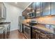 Modern kitchen boasts stainless steel appliances, granite countertops, and ample cabinet storage at 2116 Mcclintock Rd, Charlotte, NC 28205